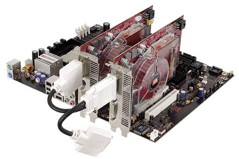 Two ATI Radeon graphics cards connected by a CrossFire dongle