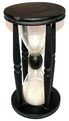 An hourglass in a wooden frame, possibly used as an egg timer